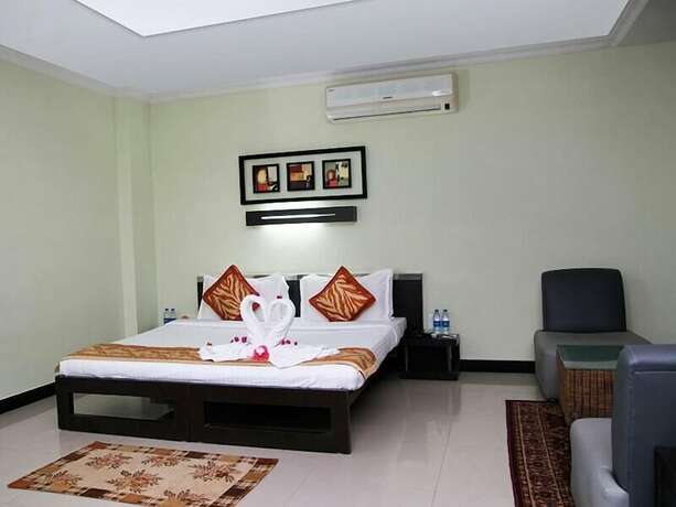 Imagen de la habitación del Hotel Hampi International. Foto 17