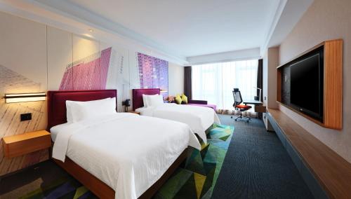 Imagen de la habitación del Hotel Hampton By Hilton Guangzhou Zhujiang New Town. Foto 5