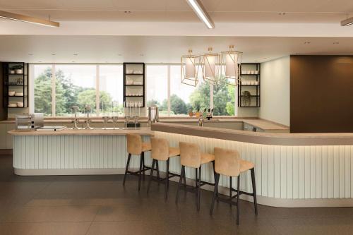 Imagen del bar/restaurante del Hotel Hampton By Hilton Locarno. Foto 4