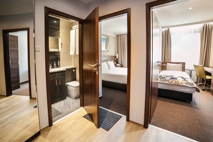 Imagen de la habitación del Hotel Hampton Suites Serviced Apartments. Foto 11