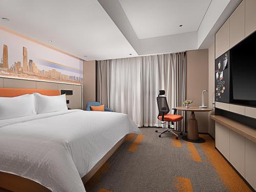 Imagen de la habitación del Hotel Hampton by Hilton Guangzhou Railway Station. Foto 11