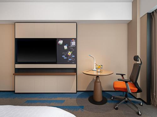 Imagen de la habitación del Hotel Hampton by Hilton Guangzhou Railway Station. Foto 12