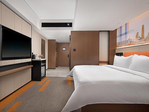 Imagen de la habitación del Hotel Hampton by Hilton Guangzhou Railway Station. Foto 14