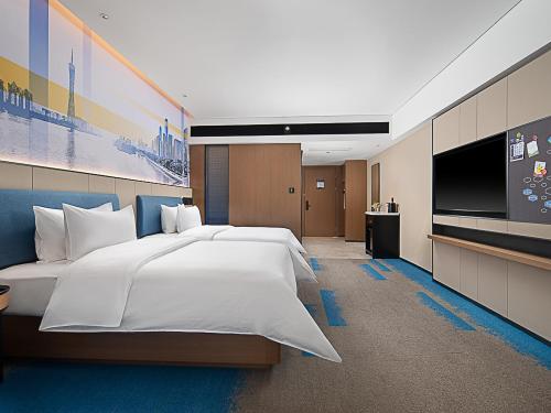 Imagen de la habitación del Hotel Hampton by Hilton Guangzhou Railway Station. Foto 16