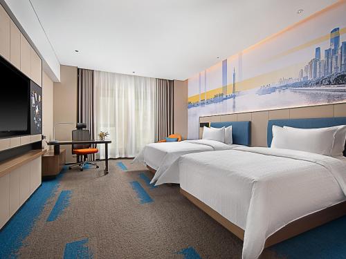 Imagen de la habitación del Hotel Hampton by Hilton Guangzhou Railway Station. Foto 18