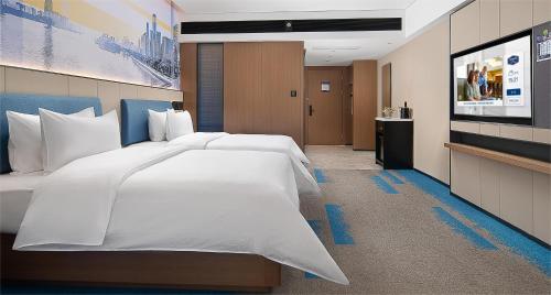 Imagen de la habitación del Hotel Hampton by Hilton Guangzhou Railway Station. Foto 19