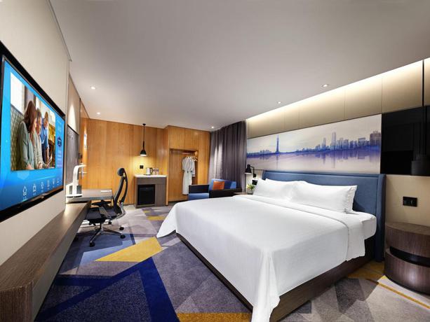 Imagen de la habitación del Hotel Hampton by Hilton Guangzhou Tianhe Sports Center. Foto 2