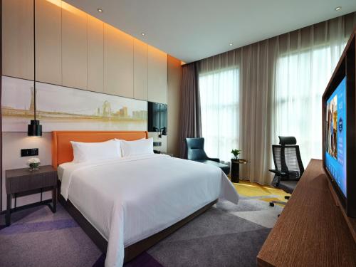 Imagen de la habitación del Hotel Hampton by Hilton Guangzhou Tianhe Sports Center. Foto 14