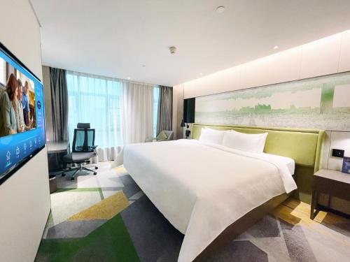 Imagen de la habitación del Hotel Hampton by Hilton Guangzhou Tianhe Sports Center. Foto 15