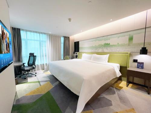 Imagen de la habitación del Hotel Hampton by Hilton Guangzhou Tianhe Sports Center. Foto 18