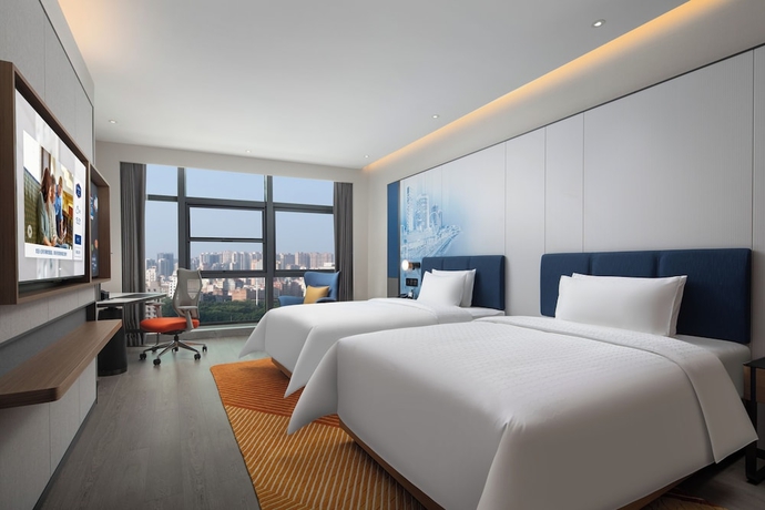Imagen de la habitación del Hotel Hampton by Hilton Jinjiang Airport. Foto 9