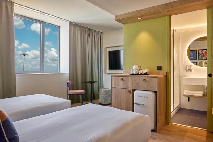 Imagen de la habitación del Hotel Hampton by Hilton Lyon Airport. Foto 4