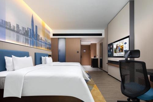 Imagen de la habitación del Hotel Hampton by Hilton Shenzhen Longgang Yonghu. Foto 7