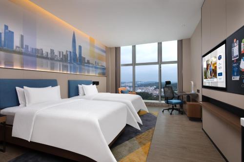 Imagen de la habitación del Hotel Hampton by Hilton Shenzhen Longgang Yonghu. Foto 8