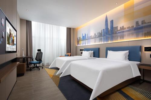 Imagen de la habitación del Hotel Hampton by Hilton Shenzhen Longgang Yonghu. Foto 10