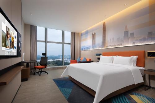 Imagen de la habitación del Hotel Hampton by Hilton Shenzhen Longgang Yonghu. Foto 12
