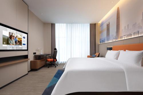 Imagen de la habitación del Hotel Hampton by Hilton Shenzhen Longgang Yonghu. Foto 14