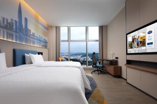 Imagen de la habitación del Hotel Hampton by Hilton Shenzhen Longgang Yonghu. Foto 15