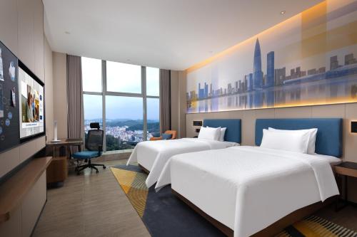 Imagen de la habitación del Hotel Hampton by Hilton Shenzhen Longgang Yonghu. Foto 16