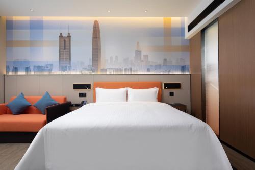Imagen de la habitación del Hotel Hampton by Hilton Shenzhen Longgang Yonghu. Foto 17