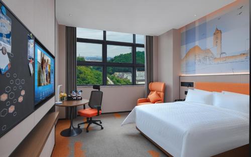 Imagen de la habitación del Hotel Hampton by Hilton Shenzhen Yuanshan. Foto 14