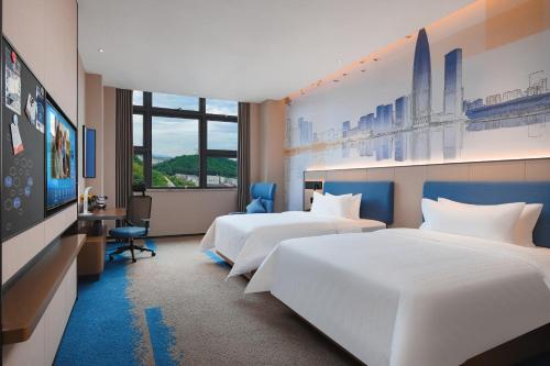 Imagen de la habitación del Hotel Hampton by Hilton Shenzhen Yuanshan. Foto 17