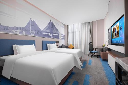 Imagen de la habitación del Hotel Hampton by Hilton Wuhan Zhongnan. Foto 12
