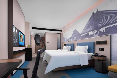 Imagen de la habitación del Hotel Hampton by Hilton Wuhan Zhongnan. Foto 13