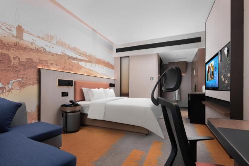 Imagen de la habitación del Hotel Hampton by Hilton Wuhan Zhongnan. Foto 19