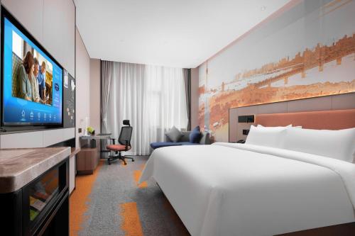 Imagen de la habitación del Hotel Hampton by Hilton Wuhan Zhongnan. Foto 20