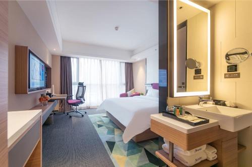 Imagen de la habitación del Hotel Hampton by Hilton Zhengzhou High-Tech Zone. Foto 4