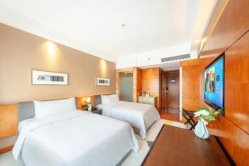 Imagen de la habitación del Hotel Hampton by Hilton Zhuhai Gongbei Port. Foto 12
