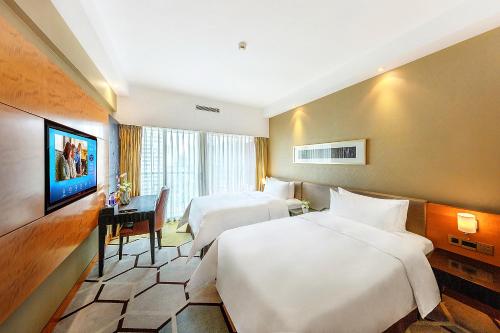 Imagen de la habitación del Hotel Hampton by Hilton Zhuhai Gongbei Port. Foto 14