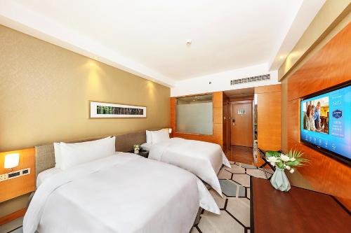 Imagen de la habitación del Hotel Hampton by Hilton Zhuhai Gongbei Port. Foto 16