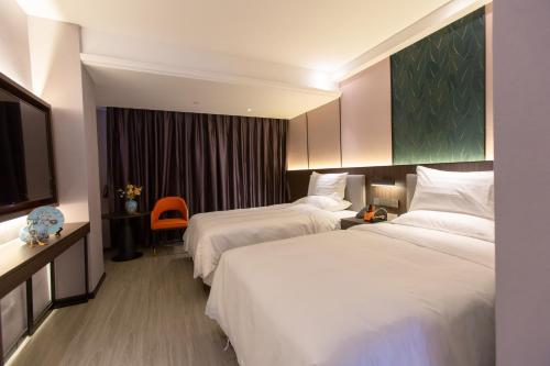 Imagen general del Hotel HanTang Haikou Business College Sun Moon Plaza Duty Free Shop. Foto 7