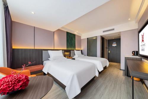 Imagen general del Hotel HanTang Haikou Business College Sun Moon Plaza Duty Free Shop. Foto 9