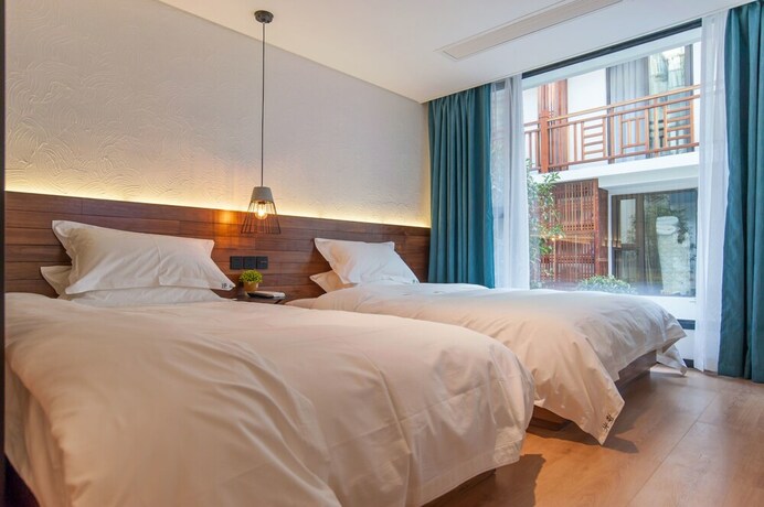 Imagen de la habitación del Hotel Hangzhou Backlighting Inn. Foto 17