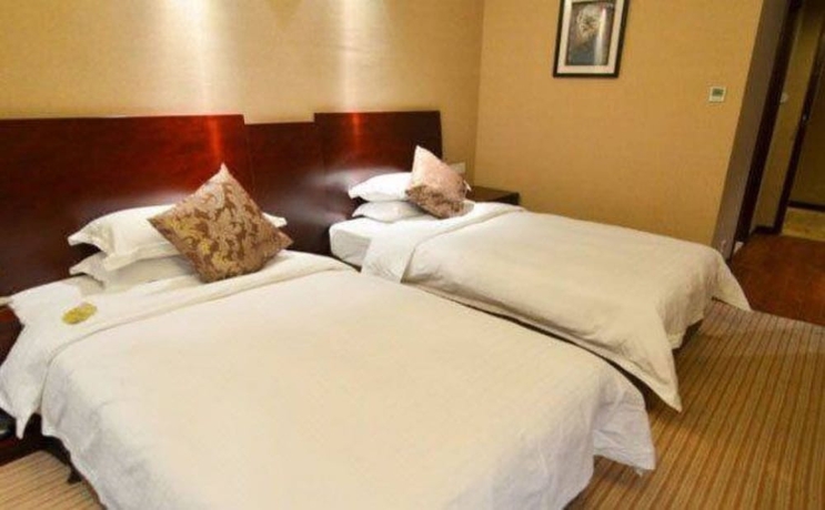 Imagen de la habitación del Hotel Hangzhou Haiwaihai Nachuan. Foto 6