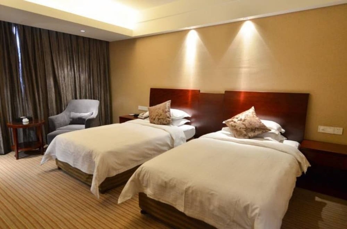 Imagen de la habitación del Hotel Hangzhou Haiwaihai Nachuan. Foto 11