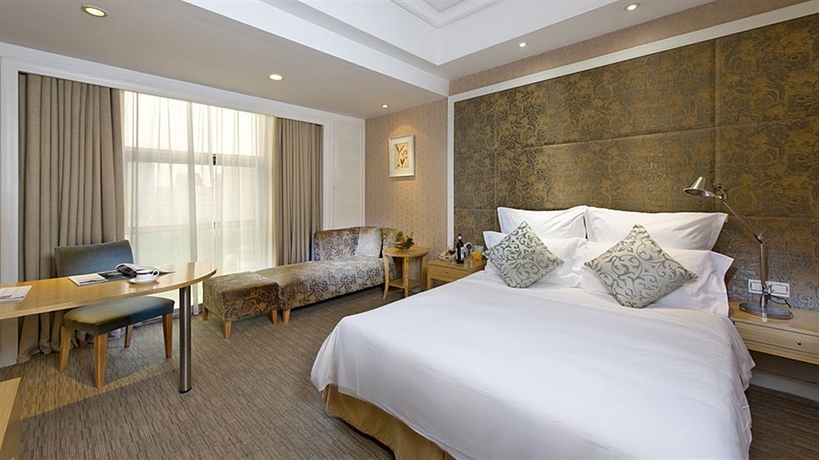 Imagen de la habitación del Hotel Hangzhou Hua Chen International. Foto 11