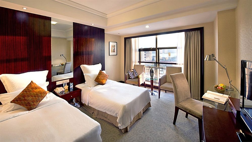 Imagen de la habitación del Hotel Hangzhou Hua Chen International. Foto 12