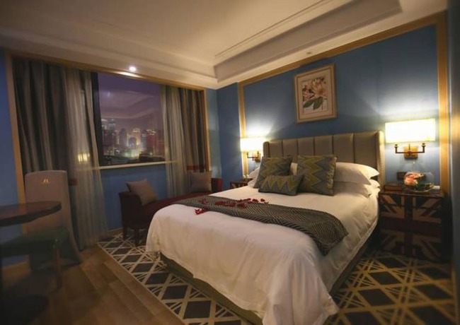 Imagen de la habitación del Hotel Hangzhou New Jiulong. Foto 7