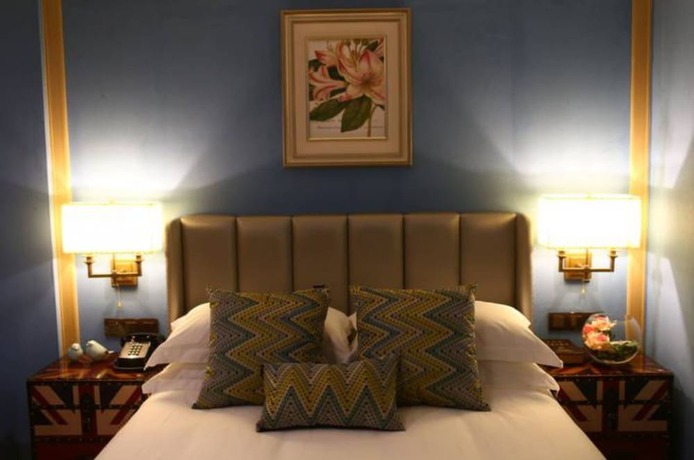 Imagen de la habitación del Hotel Hangzhou New Jiulong. Foto 8
