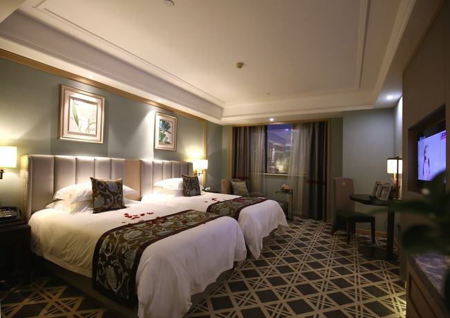 Imagen de la habitación del Hotel Hangzhou New Jiulong. Foto 11