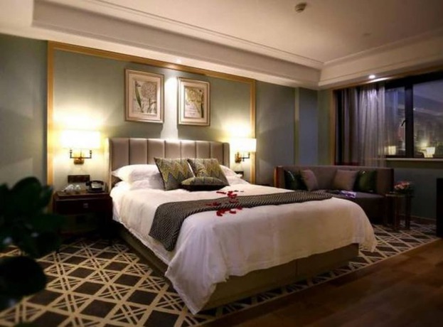 Imagen de la habitación del Hotel Hangzhou New Jiulong. Foto 16