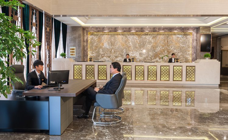 Imagen de los interiores del Hotel Hangzhou Ouyamei International. Foto 20