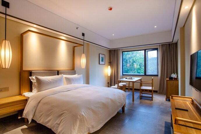 Imagen de la habitación del Hotel Hangzhou Shusheng Resort. Foto 10