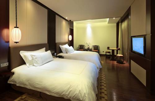 Imagen de la habitación del Hotel Hangzhou Tianyuan Tower. Foto 8