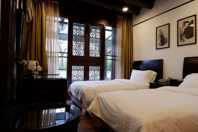 Imagen de la habitación del Hotel Hangzhou Xixi Bieyuan Resort. Foto 7