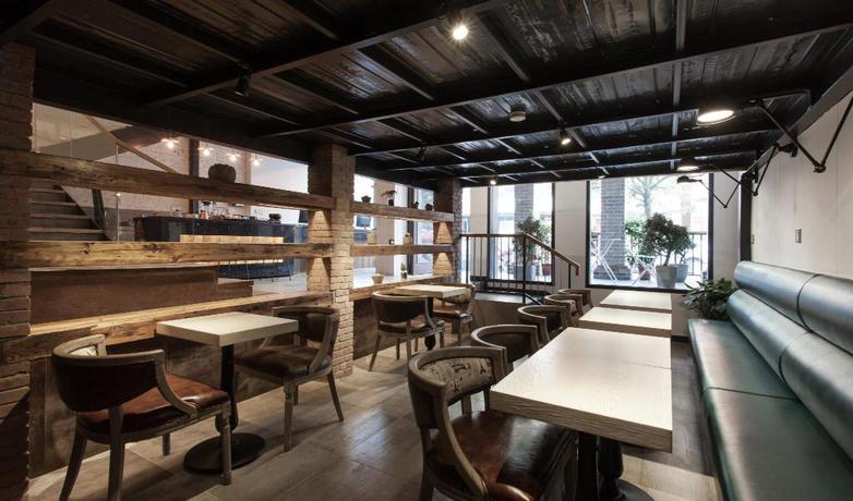 Imagen del bar/restaurante del Hotel Hangzhou Yishu Shushe Hotel. Foto 4